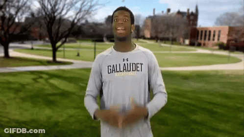 A Man Wearing A Shirt That Says Gallaudet Basketball On It GIF