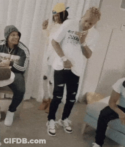 A Man Wearing A Shirt That Says Get Loud Is Dancing In A Room GIF
