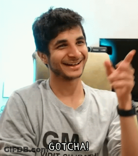 A Man Wearing A Shirt That Says Gm Gotcha Is Smiling And Giving A Thumbs Up GIF