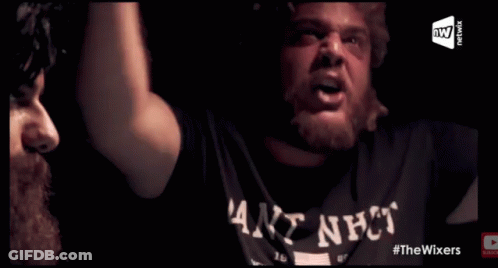 A Man Wearing A Shirt That Says ' Goat Shit ' On It Is Playing Poker GIF