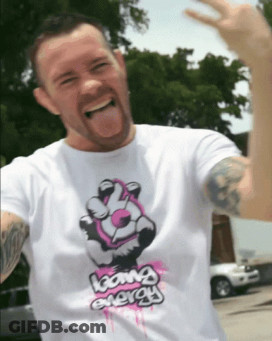 A Man Wearing A Shirt That Says Going Energy GIF