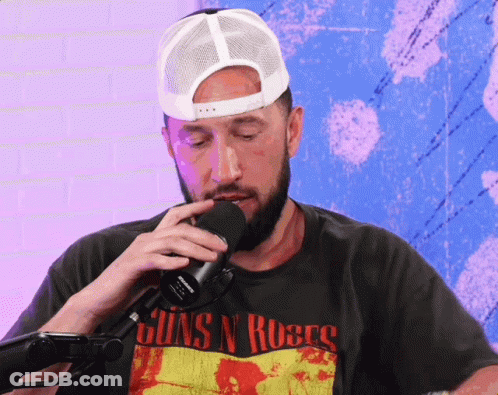 A Man Wearing A Shirt That Says Guns N Roses On It GIF