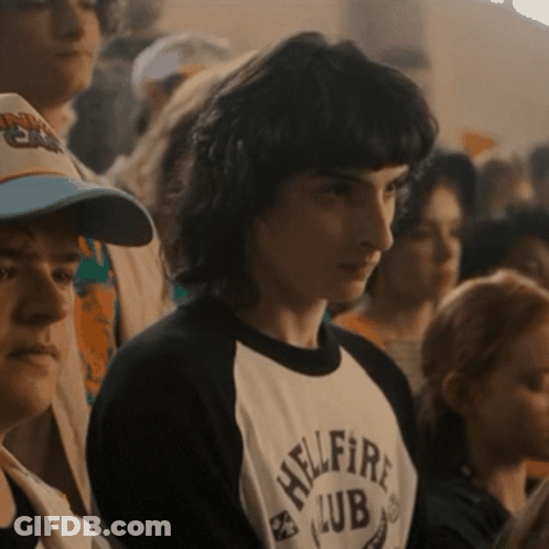 A Man Wearing A Shirt That Says Hellfire Club On It GIF