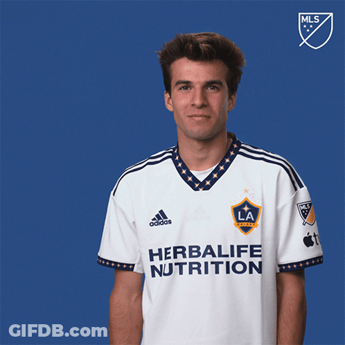 A Man Wearing A Shirt That Says Herbalife Nutrition On It GIF
