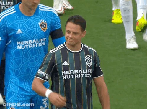 A Man Wearing A Shirt That Says Herbalife Nutrition On It GIF