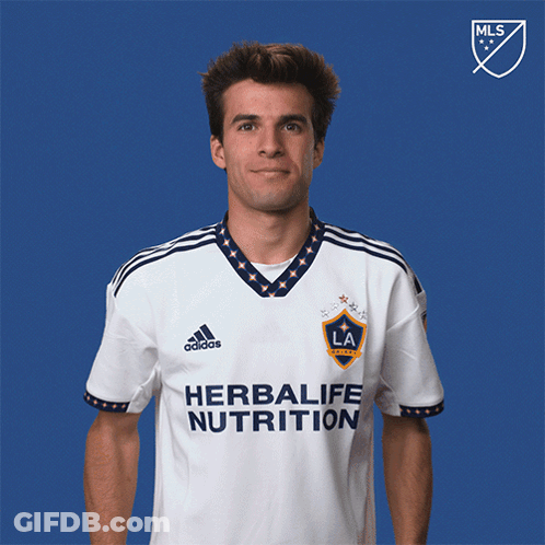 A Man Wearing A Shirt That Says Herbalife Nutrition On It GIF