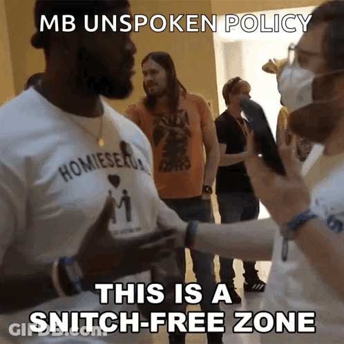 A Man Wearing A Shirt That Says ' Homiesex ' On It GIF