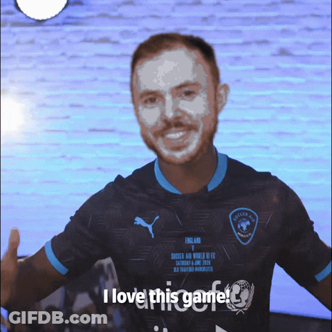 A Man Wearing A Shirt That Says I Love This Game On It GIF