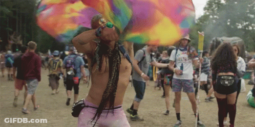 A Man Wearing A Shirt That Says ' I Love You ' On It Stands In A Crowd Of People GIF