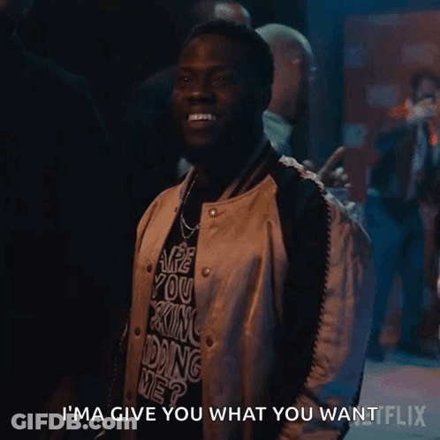 A Man Wearing A Shirt That Says I 'M Ma Give You What You Want On It GIF