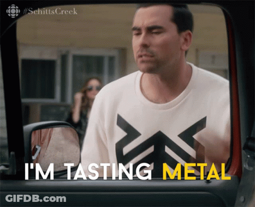 A Man Wearing A Shirt That Says I 'M Tasting Metal Looks Out Of A Car Window GIF