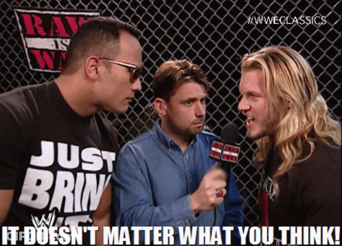 A Man Wearing A Shirt That Says Just Brin Is Talking To Two Other Men GIF