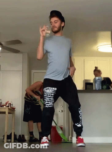 A Man Wearing A Shirt That Says Lefthand Is Standing In A Kitchen GIF