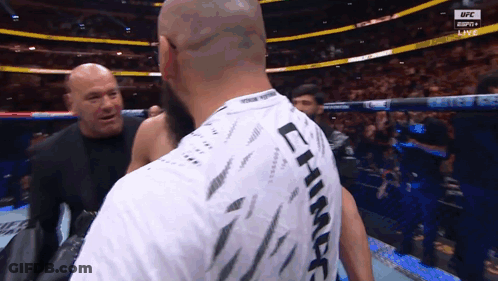 A Man Wearing A Shirt That Says ' Lt ' On It GIF