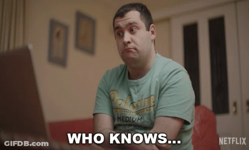 A Man Wearing A Shirt That Says Medium Is Sitting In Front Of A Laptop And Says " Who Knows " GIF