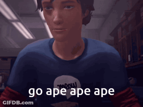 A Man Wearing A Shirt That Says Meow On It Says Go Ape Ape Ape GIF