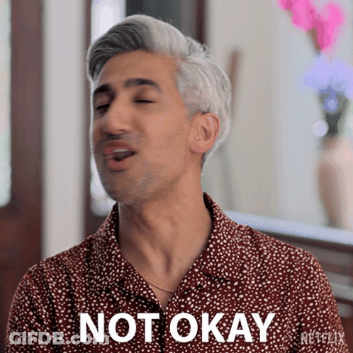 A Man Wearing A Shirt That Says Not Okay GIF