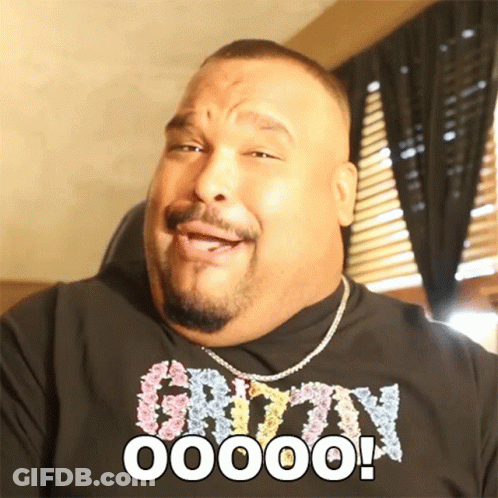 A Man Wearing A Shirt That Says ' O00000 ' On It GIF
