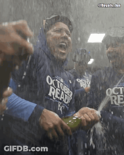 A Man Wearing A Shirt That Says October Ready Is Holding A Bottle Of Champagne GIF
