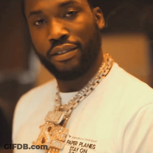 A Man Wearing A Shirt That Says " Paper Planes Stay On " GIF