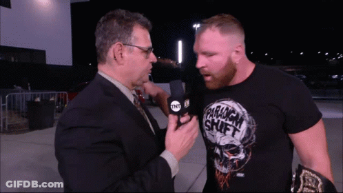 A Man Wearing A Shirt That Says Paramount Shift Is Being Interviewed By Another Man GIF