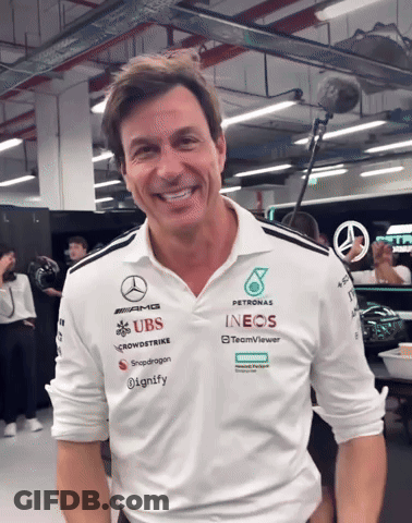 A Man Wearing A Shirt That Says ' Petronas ' On It GIF