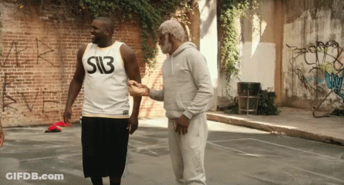 A Man Wearing A Shirt That Says S13 Shakes Hands With Another Man GIF
