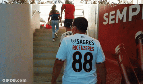 A Man Wearing A Shirt That Says Sagres Riccazeres GIF