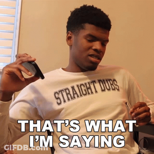 A Man Wearing A Shirt That Says Straight Dubs Is Smoking A Cigarette GIF