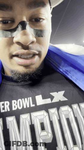 A Man Wearing A Shirt That Says Super Bowl Lx On It GIF