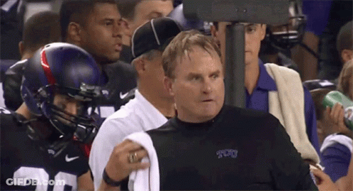 A Man Wearing A Shirt That Says Tcu Stands In A Crowd GIF