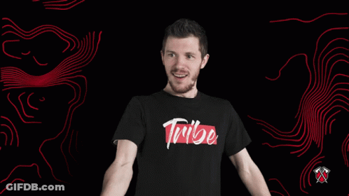 A Man Wearing A Shirt That Says Trube Holds A Wrench GIF