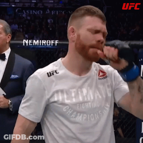A Man Wearing A Shirt That Says " Ultimate Fighting Champions " GIF
