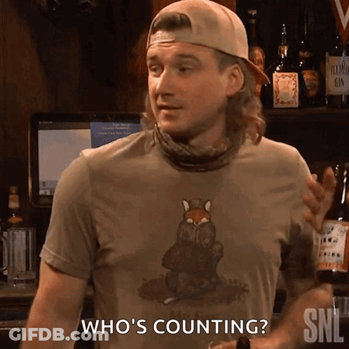 A Man Wearing A Shirt That Says ' Who 'S Counting ' GIF