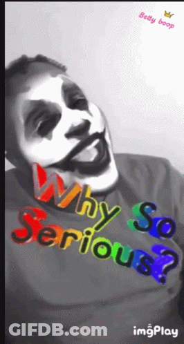 A Man Wearing A Shirt That Says " Why So Serious " GIF