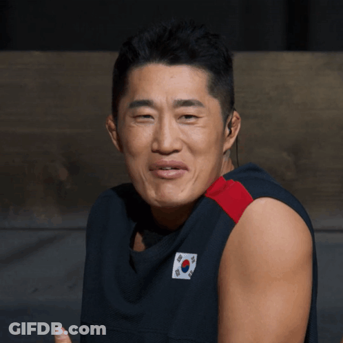A Man Wearing A Shirt With A Korean Flag On It GIF
