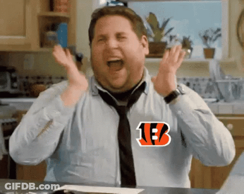 A Man Wearing A Shirt With The Letter B On It Is Screaming In A Kitchen . GIF