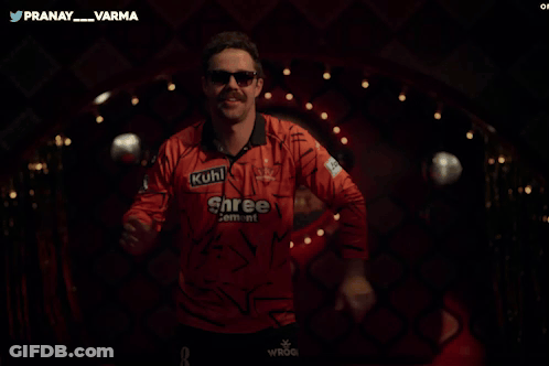 A Man Wearing A Shree Cement Shirt Is Dancing GIF