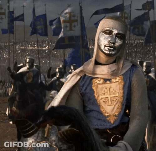Man With Silver Mask Riding Horse In Front Of Soldiers GIF