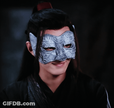 A Man Wearing A Silver Mask With A Cat Face On It GIF