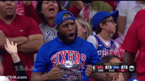 A Man Wearing A Sixers Jersey Watches A Game GIF