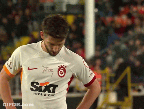 A Man Wearing A Sixt Rent A Car Jersey Looks Down GIF