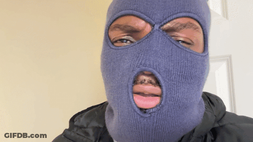 A Man Wearing A Ski Mask With A Hole In His Mouth GIF