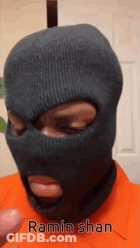 A Man Wearing A Ski Mask With The Name Ramin Shan Written On It GIF