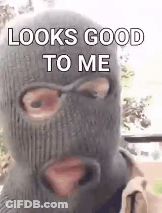 A Man Wearing A Ski Mask With The Words `` Looks Good To Me '' On It . GIF