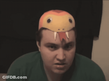 A Man Wearing A Snake Hat Looks Angry GIF