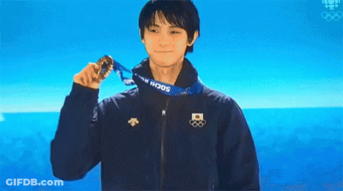 A Man Wearing A Sochi Jacket Holds A Medal Around His Neck GIF