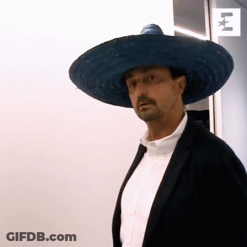 A Man Wearing A Sombrero And A Black Jacket GIF