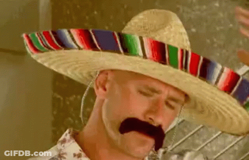 A Man Wearing A Sombrero And A Mustache Is Holding A Glass Of Water . GIF