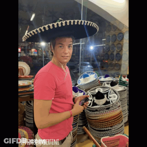 A Man Wearing A Sombrero And A Pink Shirt With @Pedrolambertini Written On It GIF